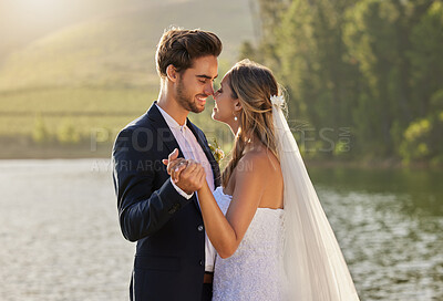 Buy stock photo Wedding, dance and couple love by lake with care and support from marriage together by water. Nature, happiness and holding hands of young people with a happy smile from trust and commitment event