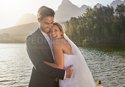 Buy stock photo Happy, hug and couple at a lake wedding with love at a ceremony, celebration and marriage. Smile, affection and a man and woman hugging after romantic relationship commitment in nature together