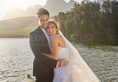 Buy stock photo Happy, hug and lake with a couple after a wedding for a ceremony, celebration and marriage. Smile, affection and funny with a man and woman laughing after a romantic relationship commitment in nature