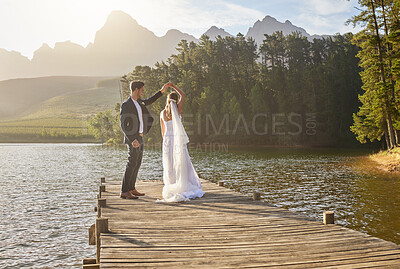 Buy stock photo Married, dance and a couple on a pier over a lake in nature with a forest in the background after a ceremony. Wedding, love or water with a bride and groom in celebration of their marriage outdoor