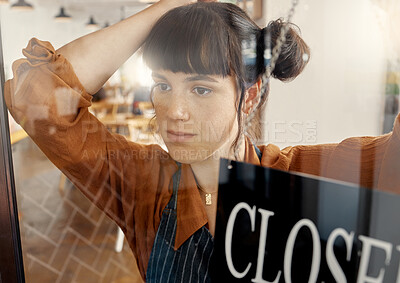 Buy stock photo Shot of a young business owner hanging up an open for business sign