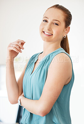 Buy stock photo Shot of an attractive young businesswoman standing alone in the office