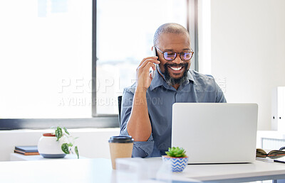 Buy stock photo Shot of a handsome mature businessman sitting alone in the office and using his cellphone