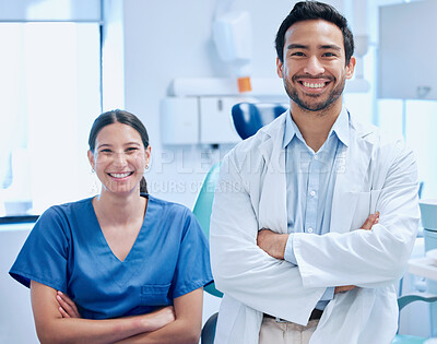 Buy stock photo Shot of a young dentist with his nurse together in their office