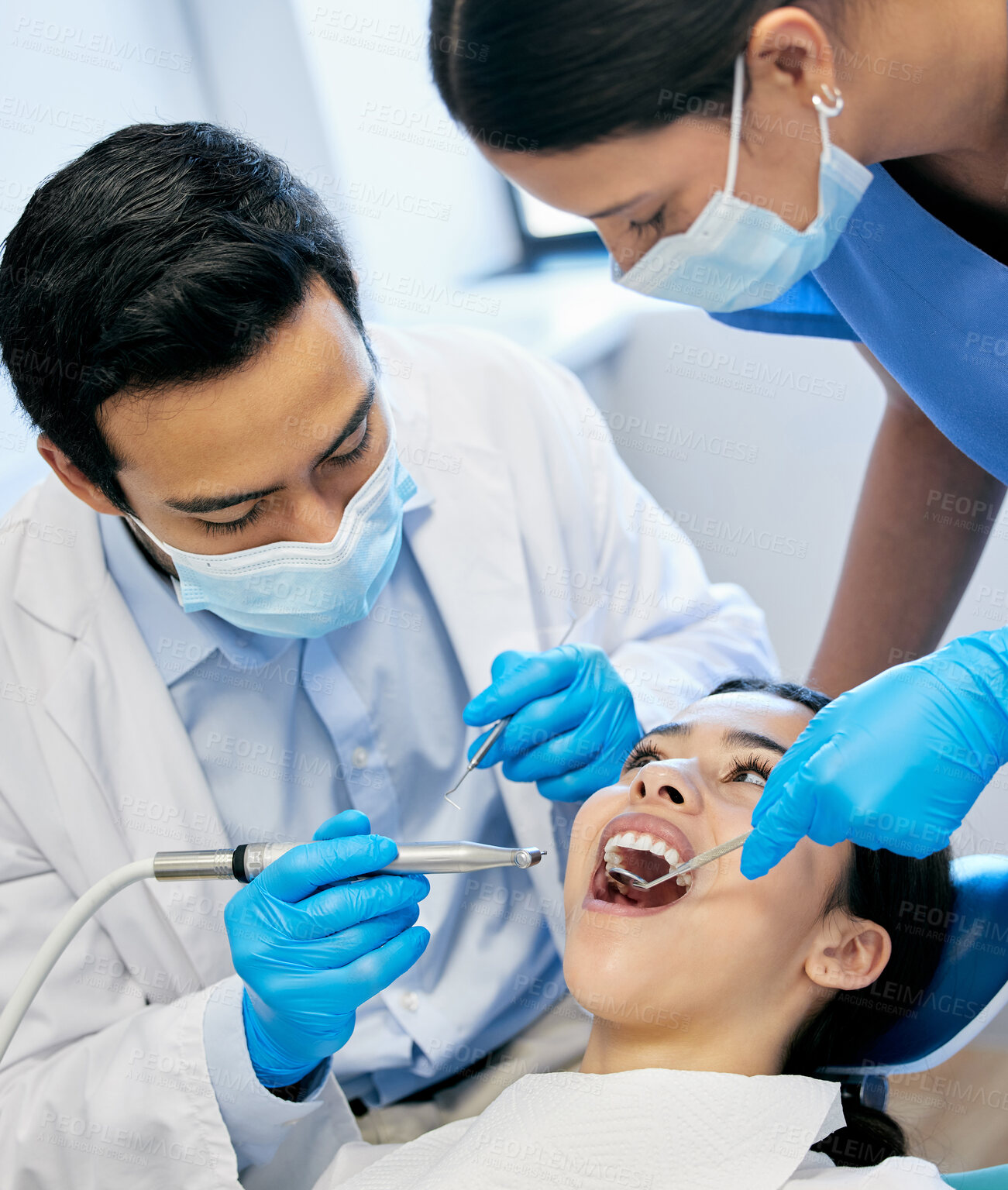 Buy stock photo Dentist team, patient and mouth inspection for hygiene with healthcare and consultation and surgery for tooth extraction. People, teeth cleaning and orthodontist with medical procedure for veneers