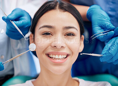 Buy stock photo Shot of a young woman looking happy in her dentists office