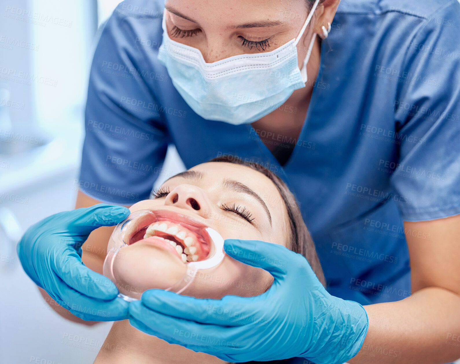 Buy stock photo Woman, dentist and mouth inspection for hygiene treatment,  teeth whitening and healthcare procedure of veneer implant. Doctor, female patient and orthodontics consultation, surgery or wellness