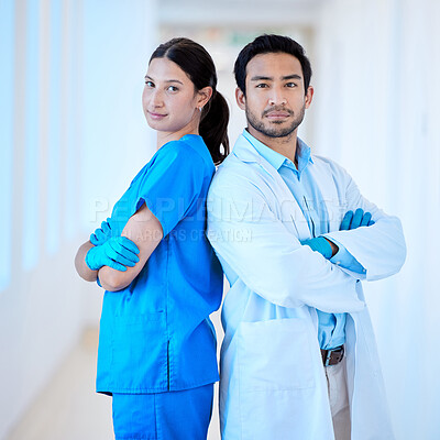 Buy stock photo Shot of a young dentist with his assistant