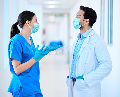 Buy stock photo Shot of a young dentist speaking to his assistant
