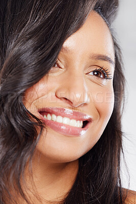 Buy stock photo Cropped shot of an attractive young woman posing in studio against a grey background