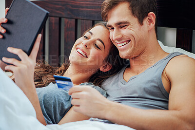 Buy stock photo Tablet, credit card and couple in bed together with budget planning, smile and web search for discount sale. Man, woman and relax in bedroom with online shopping, financial freedom and happy morning