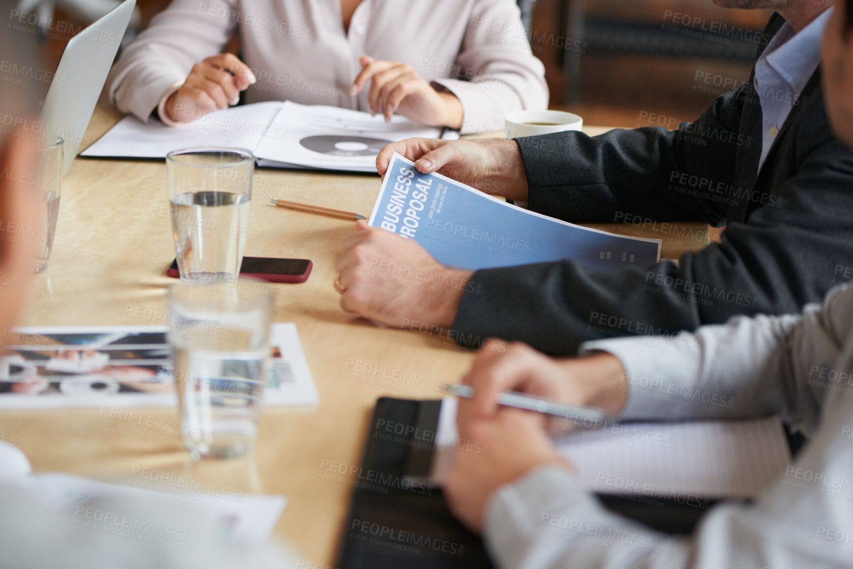 Buy stock photo Meeting, documents and hands of business people in office for planning, teamwork and proposal. Corporate, collaboration and workers in discussion with paperwork, report or feedback for finance review