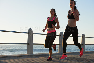 Buy stock photo Running, beach and woman of friends with fitness goals, body wellness and teamwork on morning blue sky mockup. Accountability, personal trainer and sports, athlete or runner people training outdoor