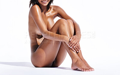 Buy stock photo Studio portrait of a gorgeous young woman smiling while sitting nude against a white background