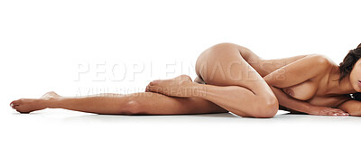 Buy stock photo Studio shot of a sexy young woman posing provocatively against a white background