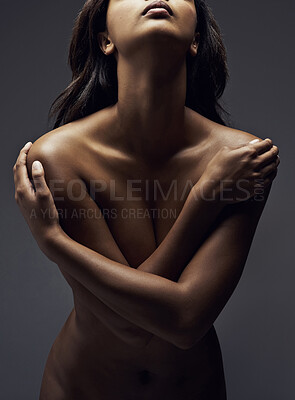 Buy stock photo Shot of a beautiful woman posing nude in the studio