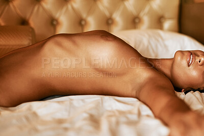Buy stock photo Cropped portrait of a sexy young woman lying nude on her bed at home