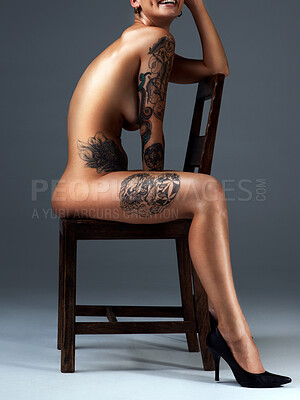 Buy stock photo Full length portrait of a beautiful young woman posing nude on a chair in the studio