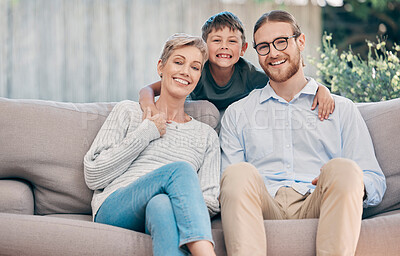 Buy stock photo Portrait of an adorable little boy relaxing with his grandmother and father on the sofa at home