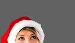 Woman wearing christmas hat. Thinking woman with Christmas hat