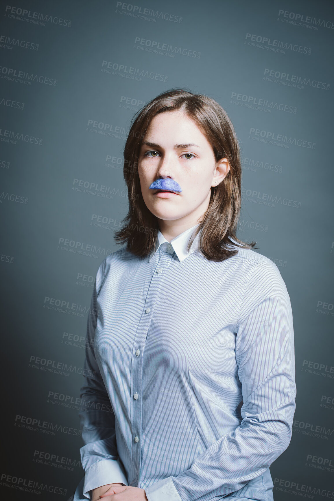 Buy stock photo Studio, portrait and woman with moustache for character, facade and cosplay with pride for halloween. Female person, creativity and ready by gray background for persona, shirt costume and serious