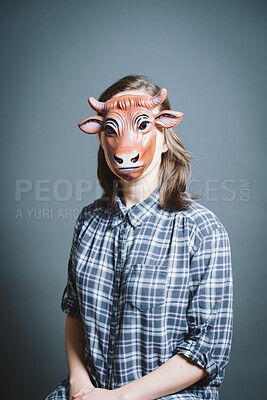 Buy stock photo Studio, portrait and woman with cow mask for character, facade and cosplay with pride for halloween. Female person,  creativity and ready by gray background for persona, bull animal and costume