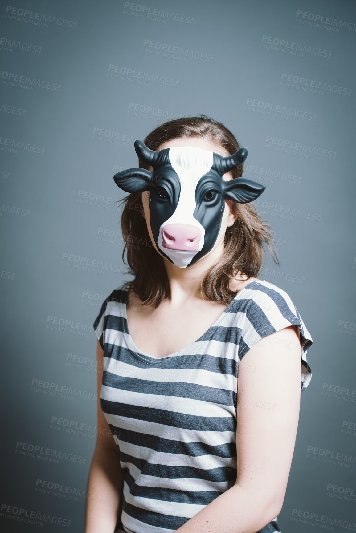 Buy stock photo Studio, woman portrait and character with mask for cow, facade and cosplay with pride for halloween. Female person,  creativity and ready by gray background for persona, animal theme and bull costume