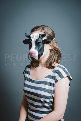 Buy stock photo Studio, person and thinking with cow mask for character, facade and cosplay with pride for halloween. Woman model,  creativity and ready by gray background for persona, animal theme and bull costume