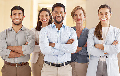 Buy stock photo Portrait of a diverse group of businesspeople standing together with their arms crossed in an office
