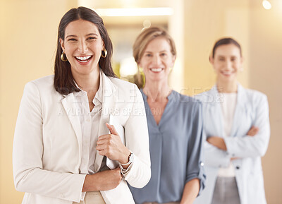 Buy stock photo Portrait of a young businesswoman holding a digital tablet in an office with her colleagues in the background