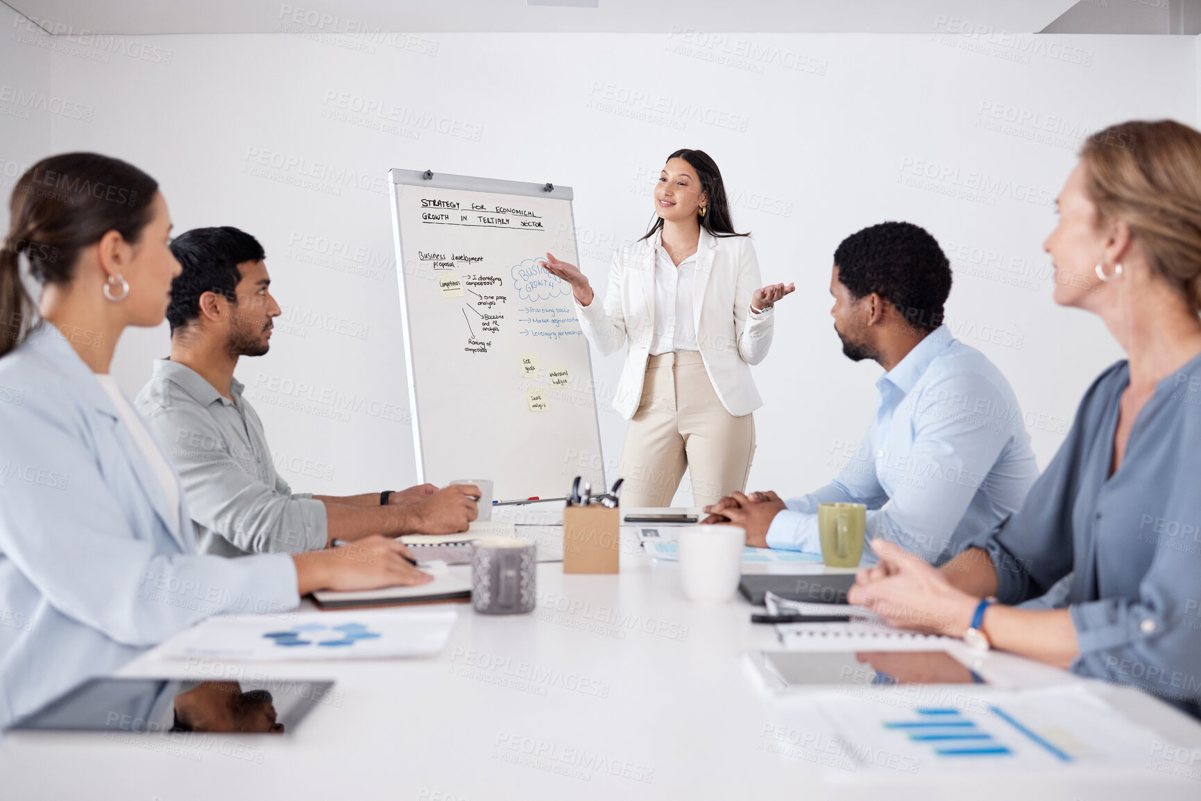 Buy stock photo Cropped shot of an attractive young businesswoman giving a presentation in the boardroom