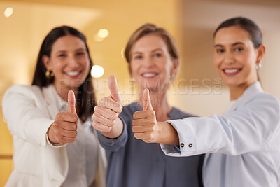 Buy stock photo Closeup shot of a group of businesswomen showing thumbs up together in an office