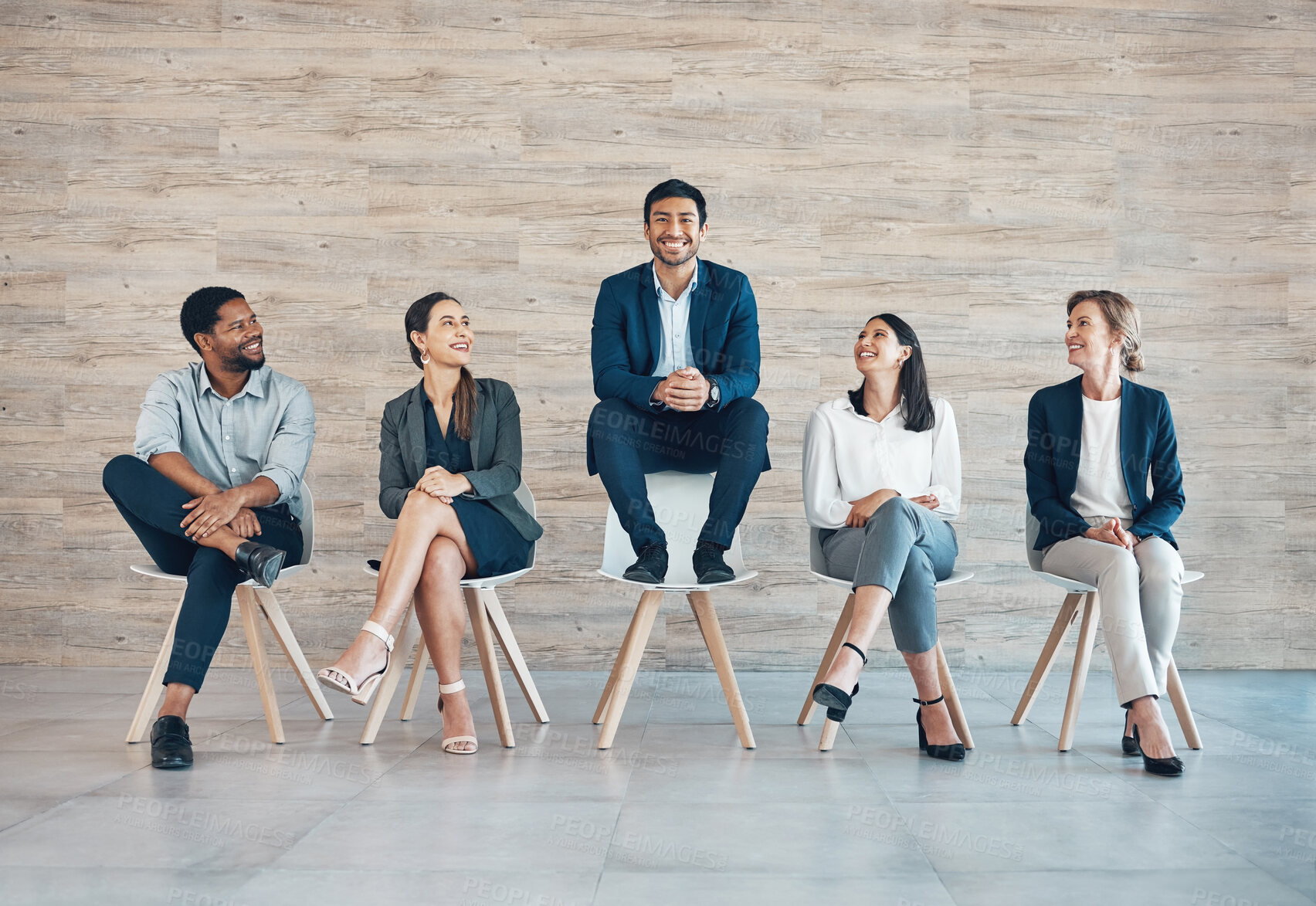 Buy stock photo Business people, recruitment or man on chair with success for interview, portrait with onboarding in office. Group, row or corporate company with staff diversity for human resource, inclusion for job