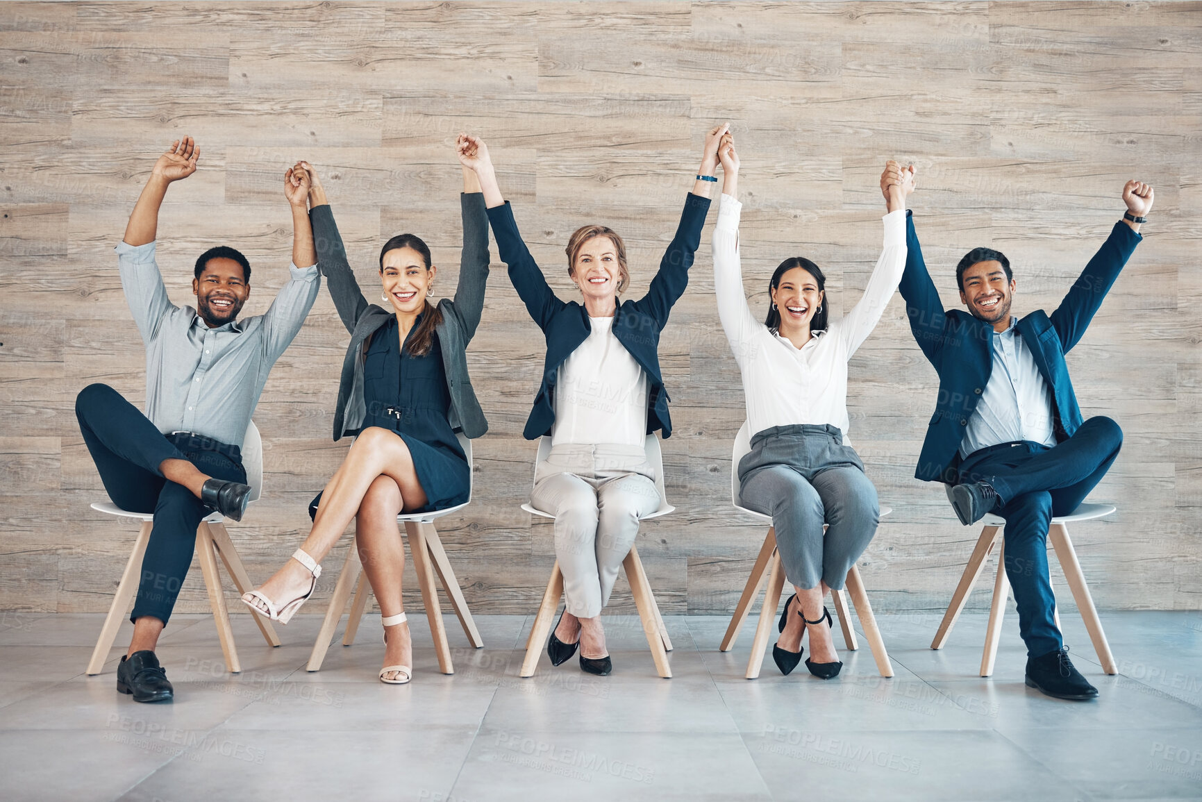 Buy stock photo People, recruitment or success on chair with hands or celebration, portrait with onboarding in office. Team, row or corporate company with staff diversity for hr, arms raised for job with solidarity