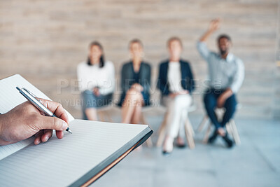 Buy stock photo Cropped shot of an unrecognisable businessman writing in a notebook while hosting interviews in the office