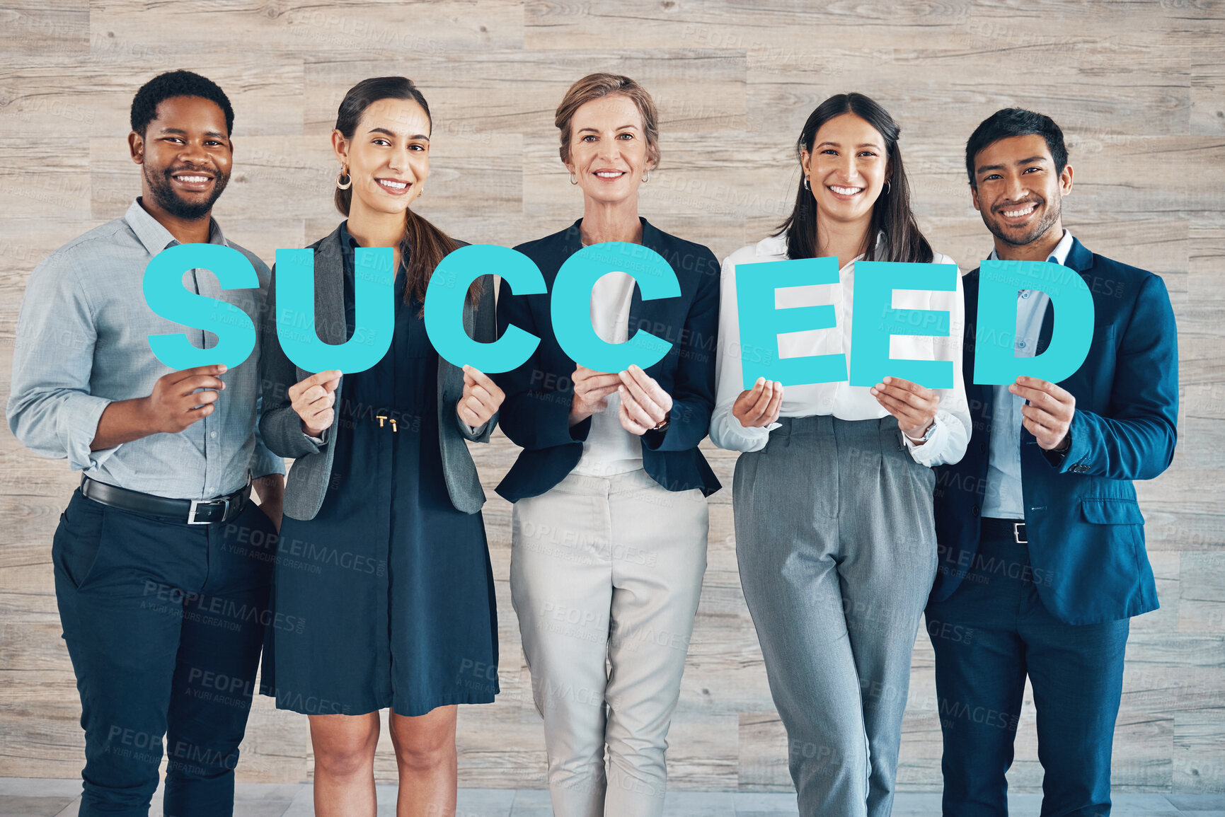 Buy stock photo Shot of a diverse group of businesspeople standing together and holding signs in the office