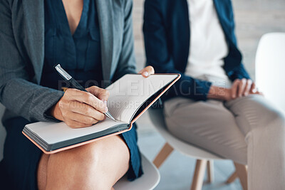 Buy stock photo Woman, notebook and writing at job interview for notes, waiting room and candidates for opportunity. Female person, schedule and diary for appointments, company and planning in journal with coworkers