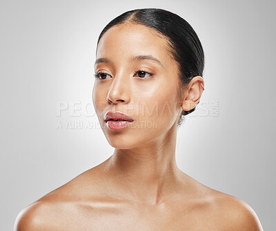 Buy stock photo Studio shot of an attractive young woman posing against a grey background