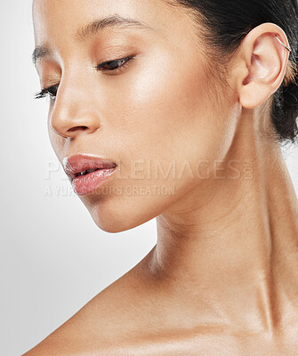 Buy stock photo Studio shot of an attractive young woman posing against a grey background