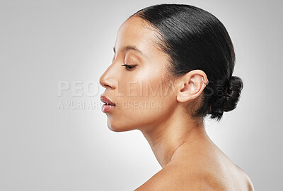 Buy stock photo Studio shot of an attractive young woman posing against a grey background