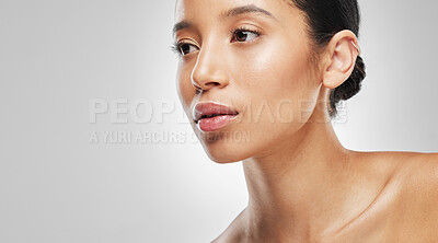 Buy stock photo Studio shot of an attractive young woman posing against a grey background