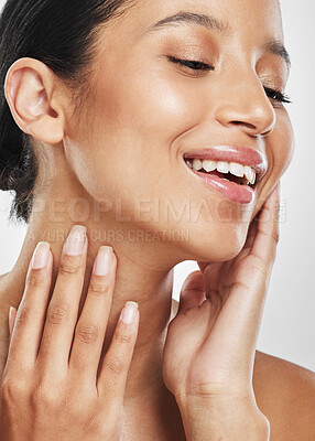 Buy stock photo Studio shot of an attractive young woman posing against a grey background