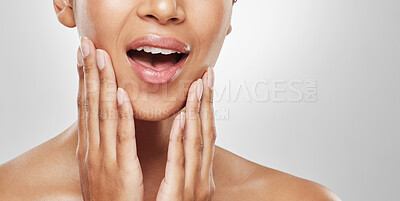 Buy stock photo Studio shot of an unrecognisable woman experiencing toothache against a grey background