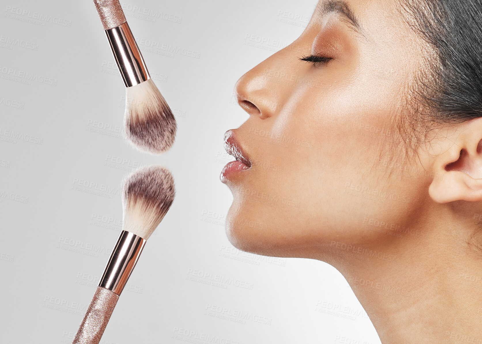 Buy stock photo Side, profile and woman in studio with brushes, cosmetics and product for beauty routine. Wellness, application and person with makeup tools for grooming, self care or foundation on white background