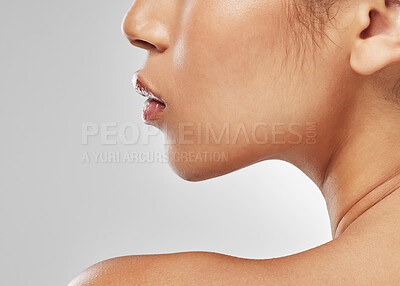 Buy stock photo Studio shot of an unrecognisable woman posing against a grey background