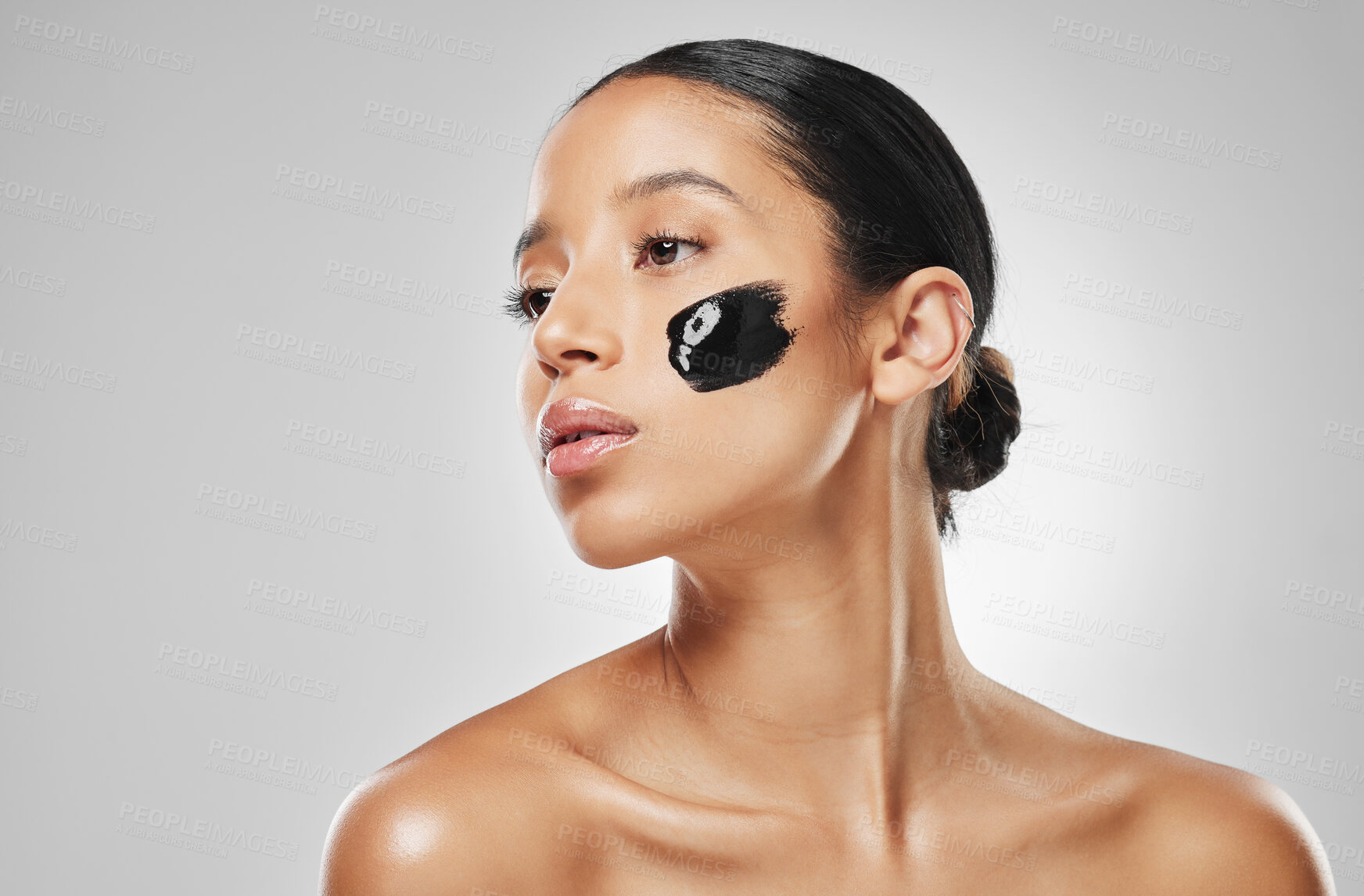 Buy stock photo Woman, beauty and face mask in studio with charcoal, skincare cosmetics and pore cleansing benefits. Space, female person and facial product for glow, self care and dermatology on white background.