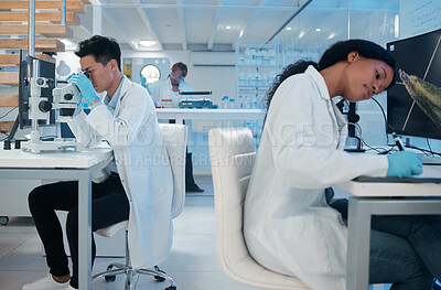 Buy stock photo Shot of two coworkers peacefully working together in a lab