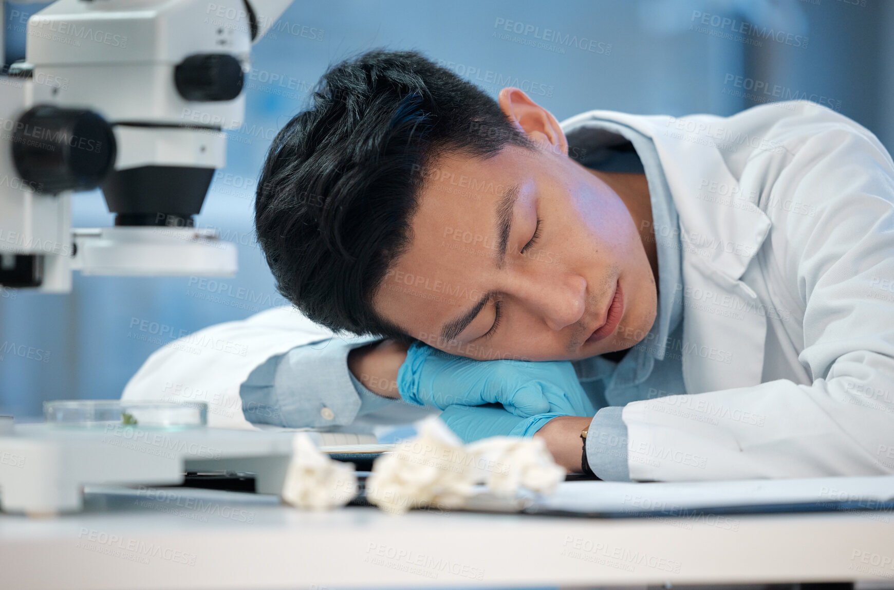 Buy stock photo Sleeping, science and man in lab, research and experiment with burnout, exhausted and overworked. Asian person, medical and professional in workplace, nap and fatigue with waiting for test results