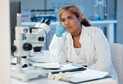 Buy stock photo Shot of a young woman looking bored while at work in her lab