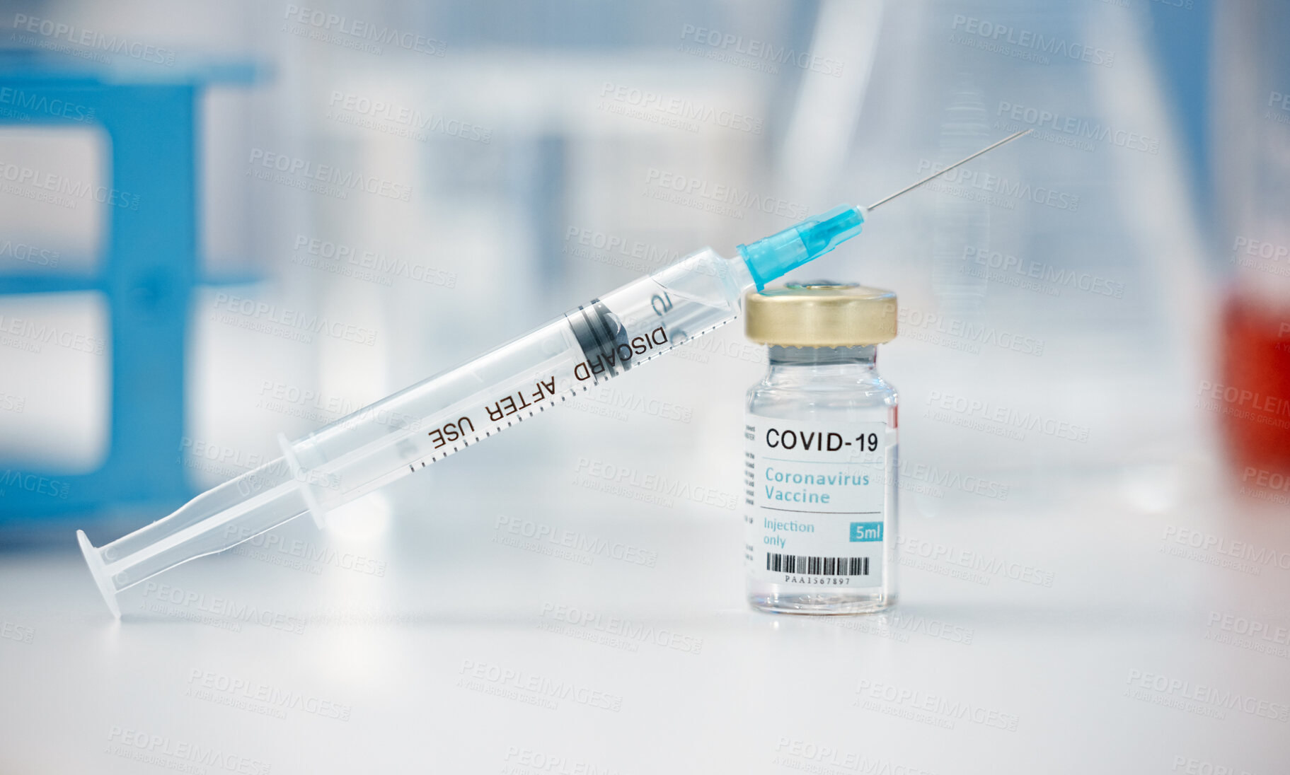 Buy stock photo Needle, covid or vaccine with vial on table for cure, pandemic or flu shot at hospital or clinic. Empty, syringe and bottle with drug sample, antibiotic or vaccination for injection or medical remedy